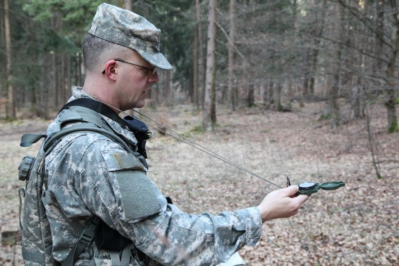 soldier using compass